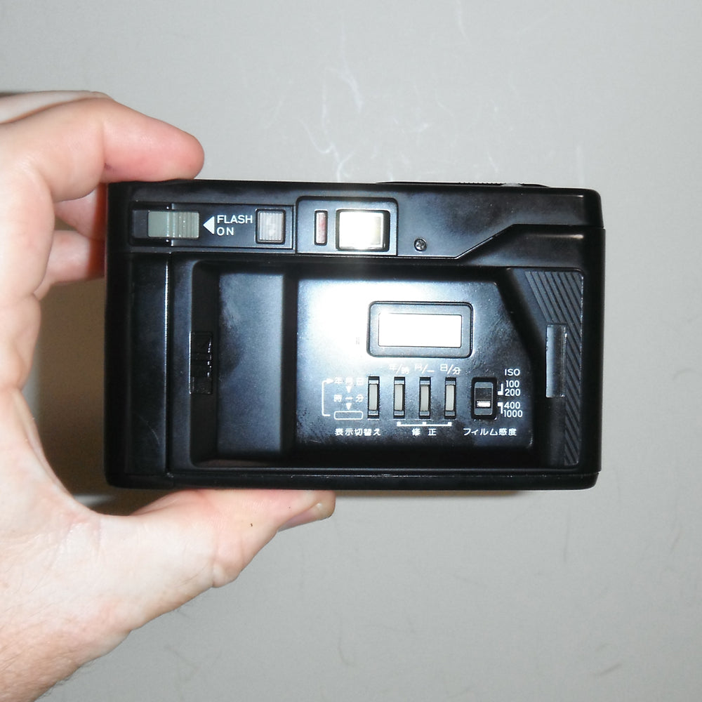 Rear of Yashica T AF-D showing viewfinder, controls, and film door