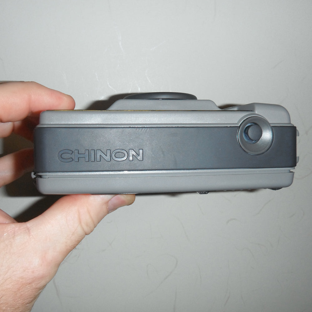 Top-down angle of camera highlighting shutter button and flash area